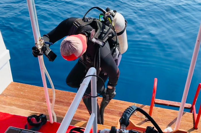 Scuba Diver Preparing To Dive Off The Back Of A Liveaboard