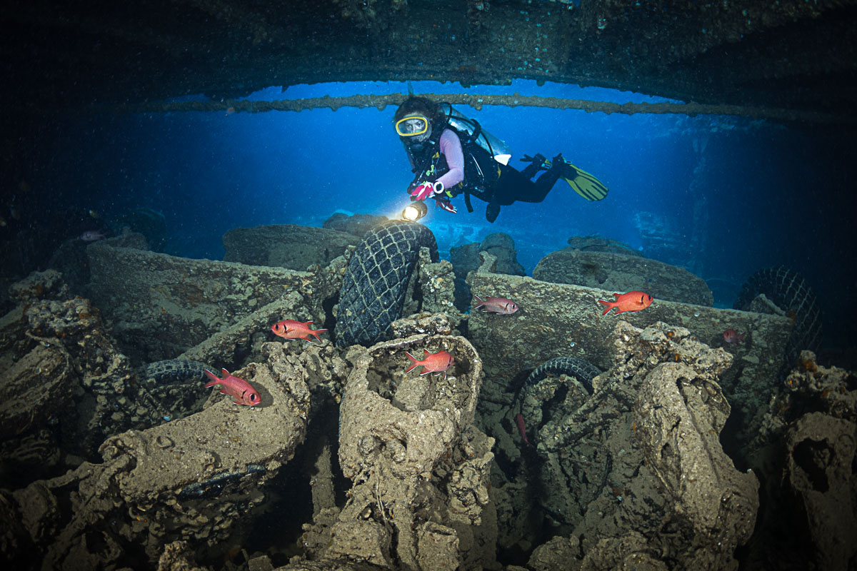A diver admires the Thistlegorm's cargo of vehicles