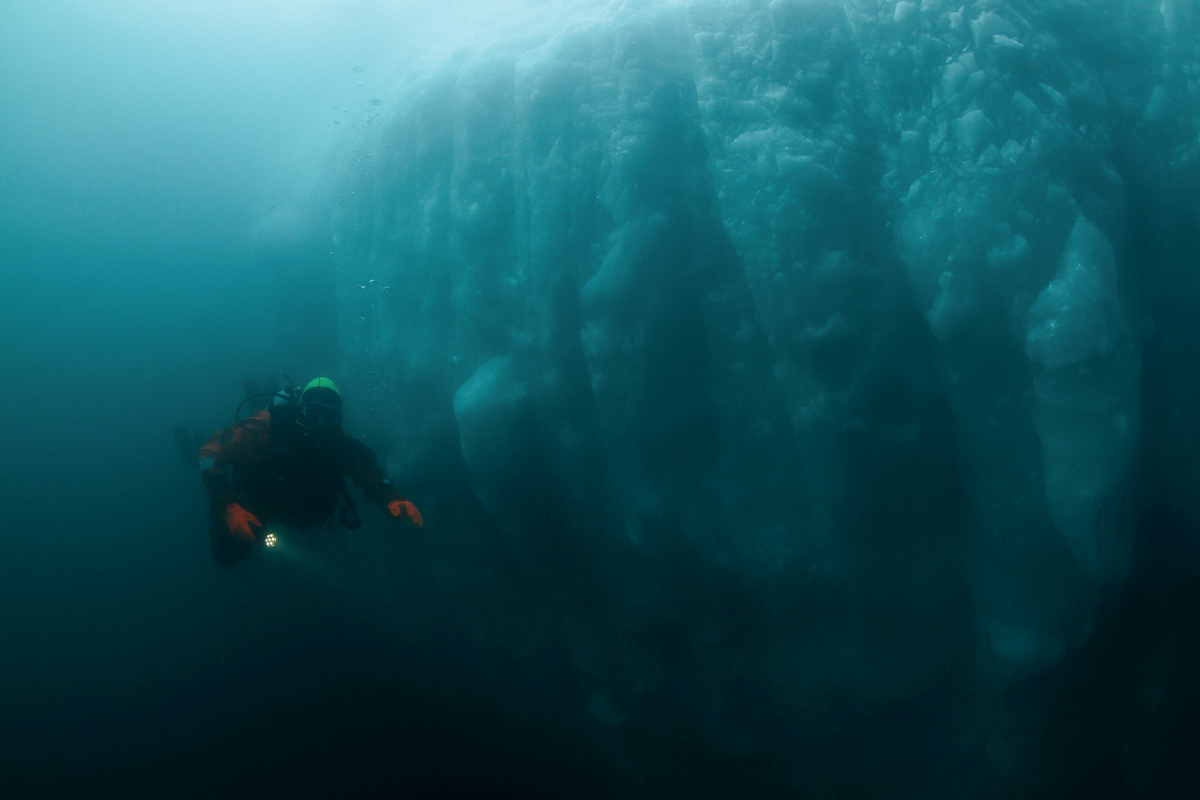 Diving alongside a glacier.