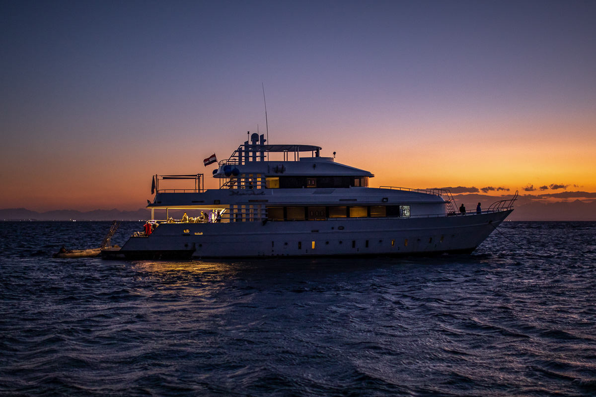 A dive liveaboard at dusk in the Red Sea