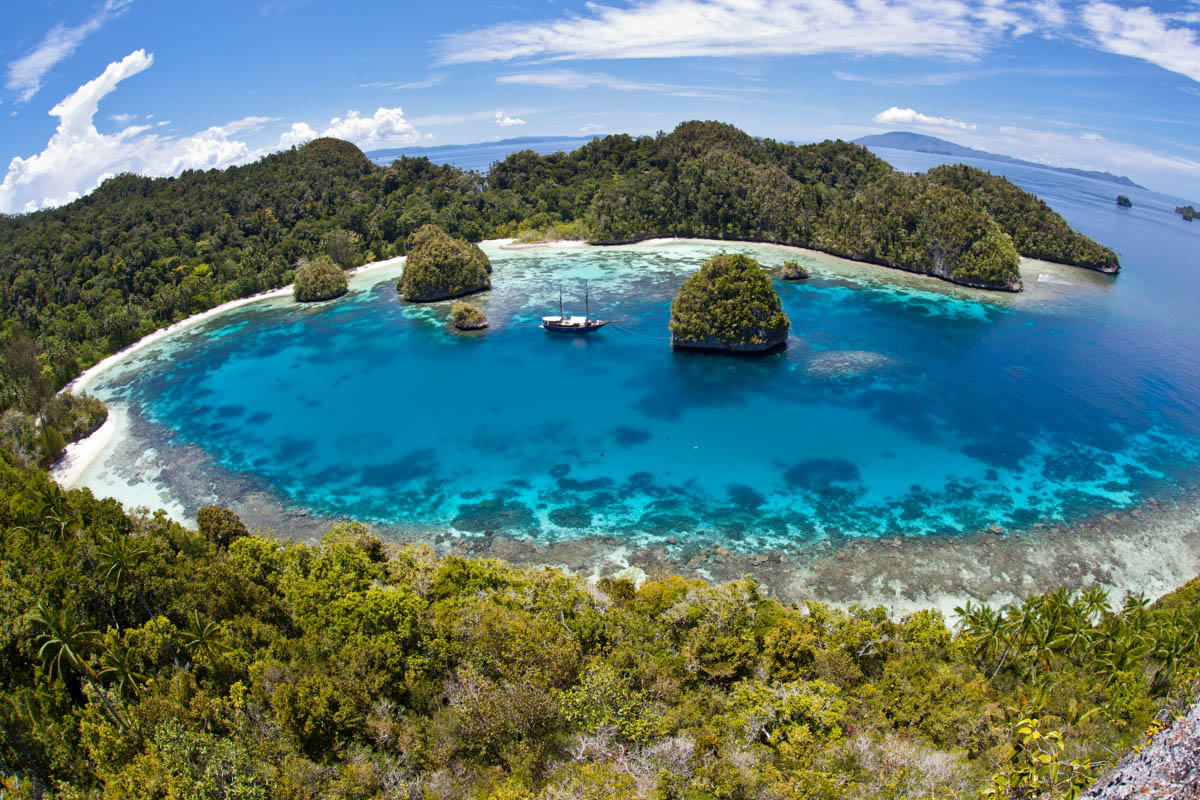 A dive liveaboard moored in one of Raja Ampat's many lagoons