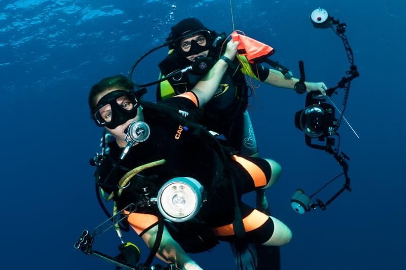 Underwater photographers with their cameras in Lembeh, North Sulawesi