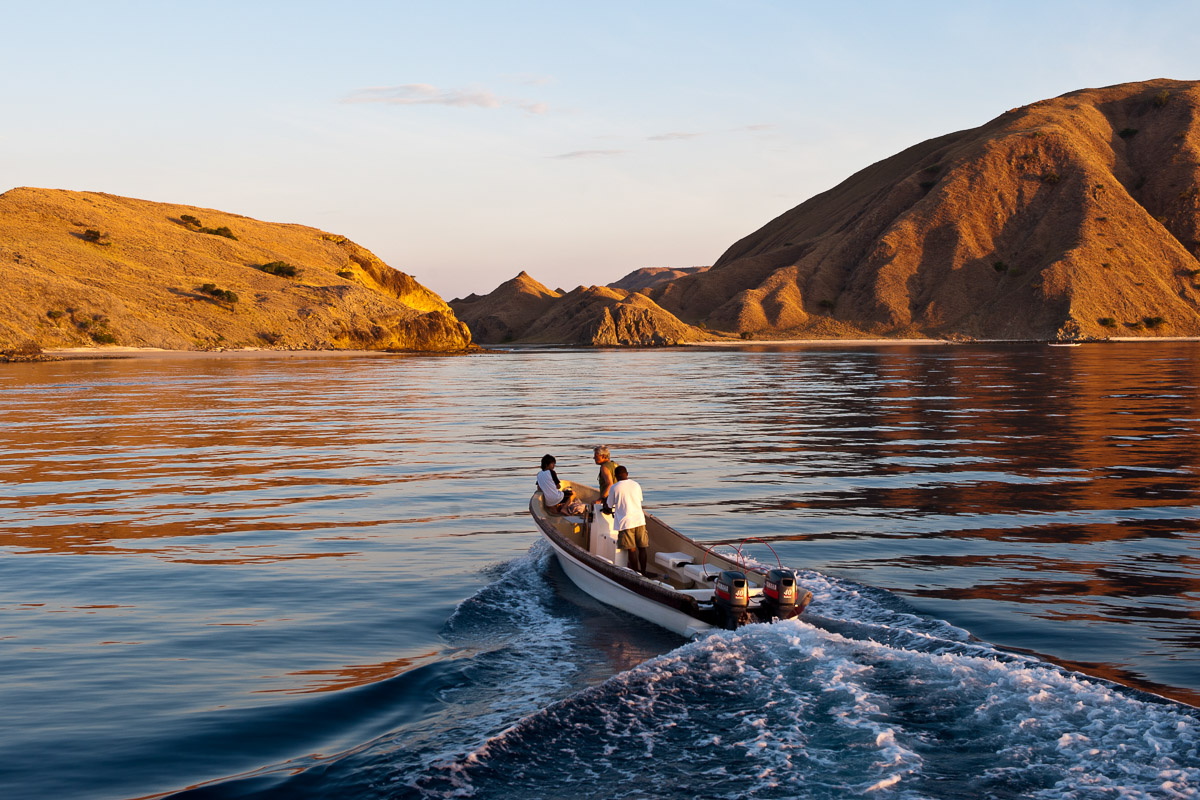 Dive guides on a dive tender checking conditions during a liveaboard cruise